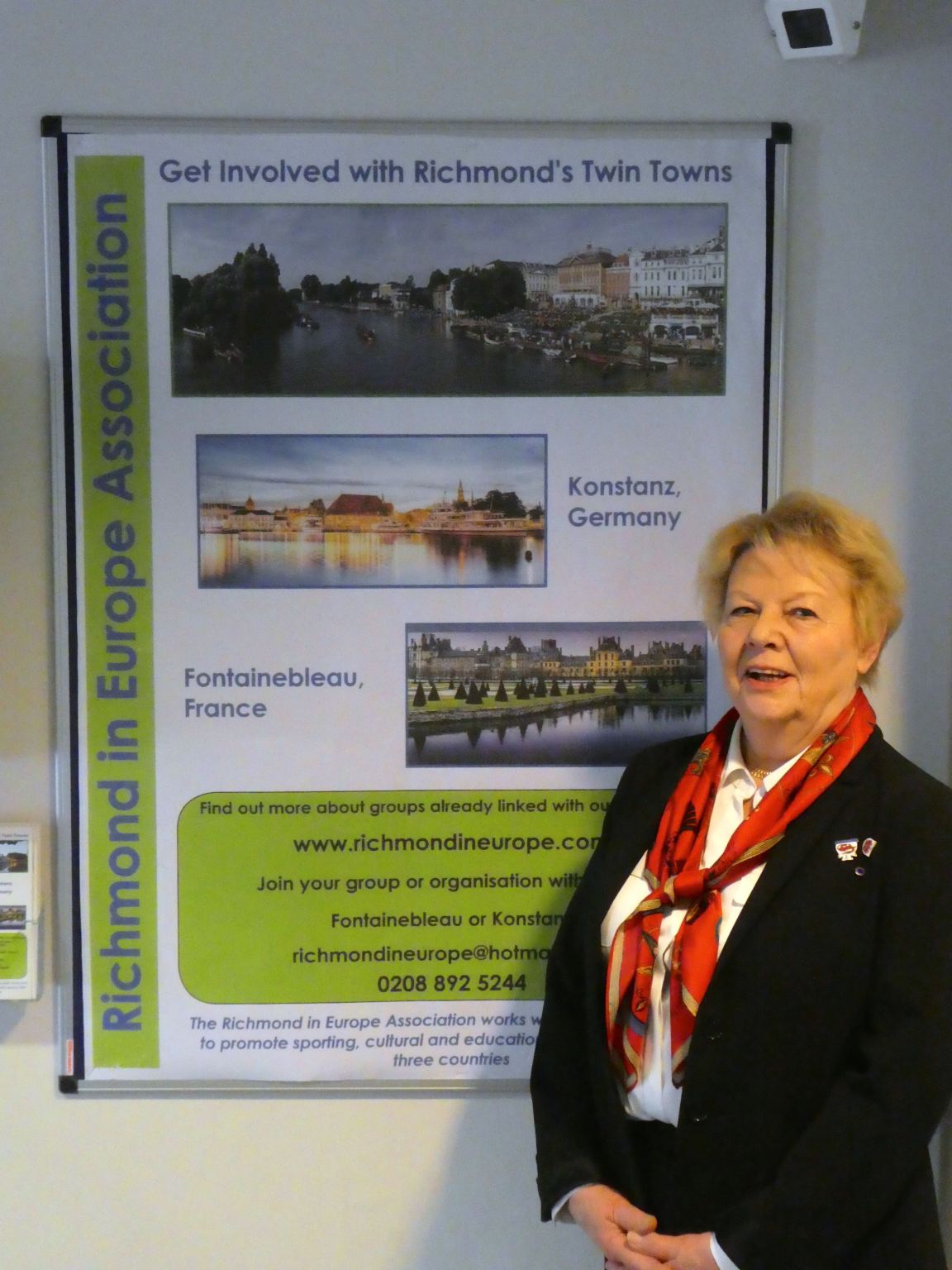 Evelyne with poster in civc centre